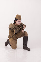 A woman in a retro military uniform, a soldier of the Soviet army during World War Two