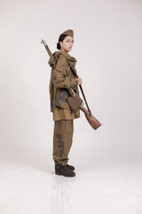 A woman in a retro military uniform, a soldier of the Soviet army during World War Two