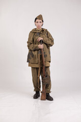 A woman in a retro military uniform, a soldier of the Soviet army during World War Two