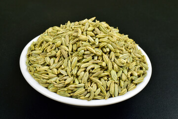 Closeup of fennel seeds on bowl