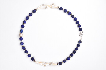 Obraz premium Semi precious blue beads necklace isolated on white background