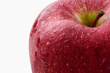Closeup of apple with dew drops isolated on white background