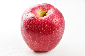 Ripe red apple with water drops isolated on white background, fresh fruit