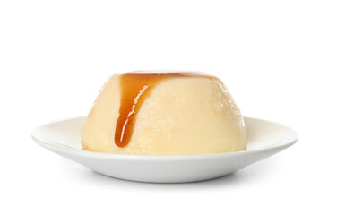 Plate with delicious pudding covered by caramel syrup isolated on white background