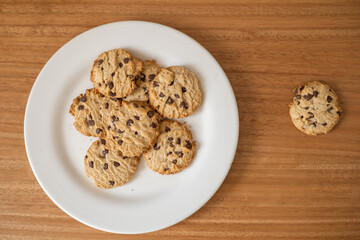 wallpaper with chocolate chip cookies, appetizing sweet and healthy food, texture in studio