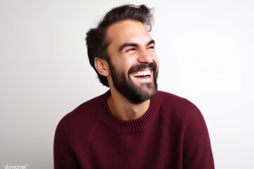 Lifestyle portrait photography of a cheerful man in his 30s wearing a cozy sweater against a white background. Generative AI