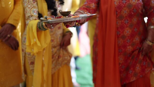 Religious Hindu ritual practicing. Unrecognized people in traditional, colorful clothes collecting donations for sacrificing ritual. High quality 4k footage
