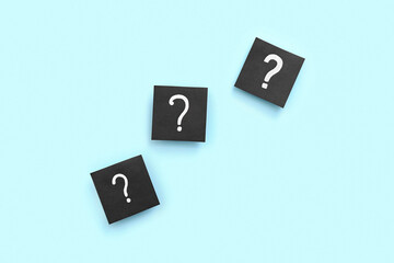 Papers with question marks on blue background
