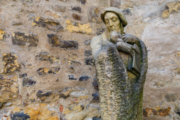 Ancient sculptures in the architecture of the city. Historical and cultural heritage. Background.