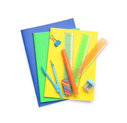 Colorful notebooks and stationery supplies on white background