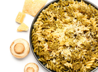 Plate of tasty Italian pasta with Parmesan cheese on white background, closeup