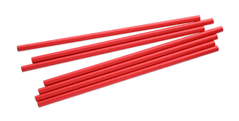 Red paper cocktail straws on white background, top view
