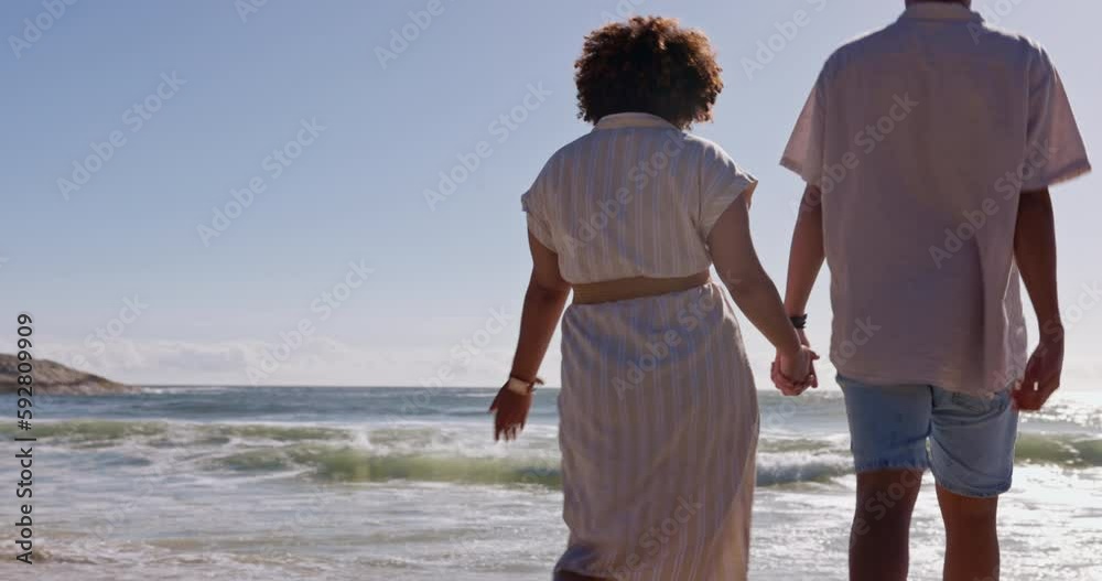 Poster Walking, relax and holding hands with couple at beach for travel, love and summer vacation. Happy, relationship and romance with man and woman on date for bonding, affectionate and commitment