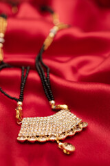 Mangalsutra locket on silk cloth, indian bride accessory
