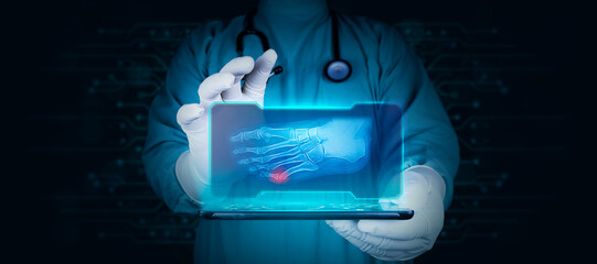 Doctor with tablet isolated analyzes an x-ray of the fracture of the little finger of the foot....