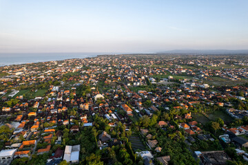 Aerial view of the Canggu area, one of the Bali beachside areas experiencing massive development. The conversion of agricultural land into an entertainment center and housing.