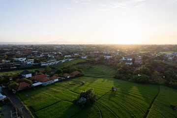 Aerial view of the small remaining rice fields in Canggu, Bali. Canggu experienced the conversion of agricultural land into an entertainment center and housing.