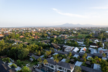 Obraz premium Aerial view of the Canggu area, one of the Bali beachside areas experiencing massive development. The conversion of agricultural land into an entertainment center and housing.