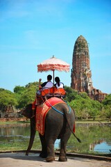 A couple riding elephant in Ayutthaya, Thailand