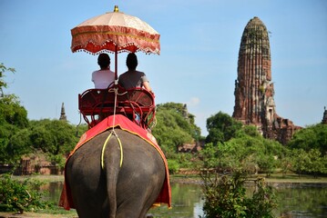 A couple riding elephant in Ayutthaya, Thailand