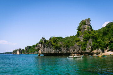 Obraz premium Tropical island rocks on a blue sea. Calatrava, Romblon, Philippines
