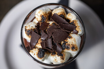 Chocolate shavings and marshmallows in a cup
