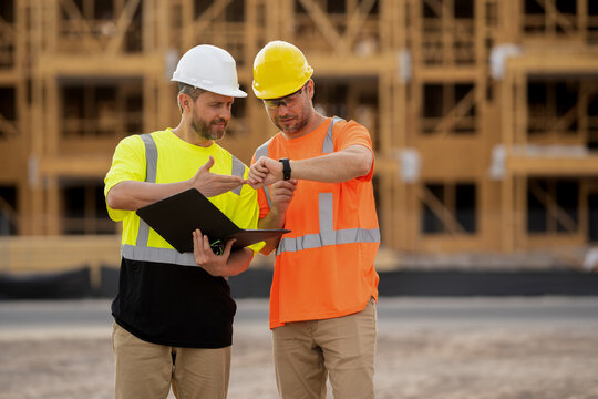architect men checking construction project outdoor. architect men have construction project