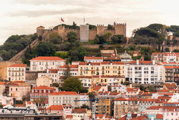 Fototapeta premium Lisbon cityscape panorama caslte sao jorge Portugal, beautiful European city summer, colored houses roofs