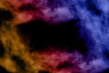 Colored artificial smoke in the dark on a black background. Very creative and abstract and perfect for a wallpaper.