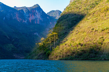 The alley of the Nho Que river. A famous river located in Ha Giang Vietnam is jade green