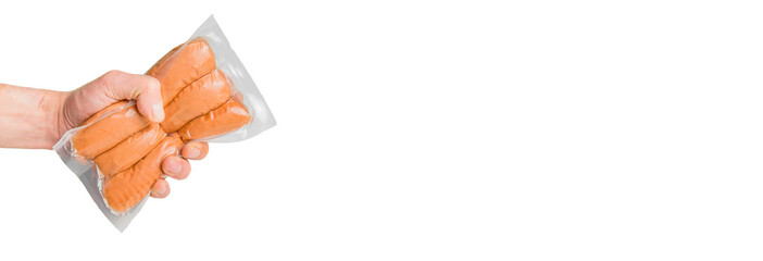 Raw sausages in plastic packaging. The hand holds sausages. Large size, space for your text. Isolate on white