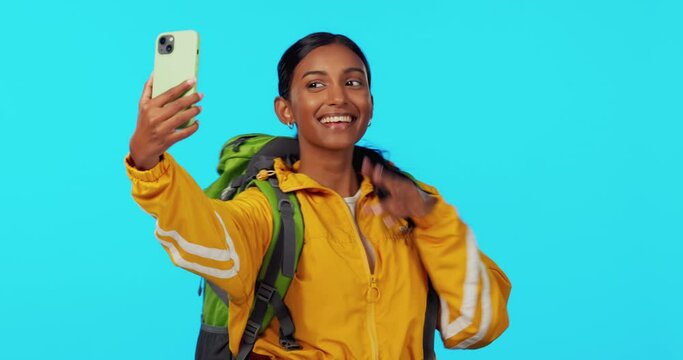 Selfie, travel or happy woman tourist in studio with mockup space taking pictures with peace sign. Influencer, smile or Indian girl photographer hiking or vlogging for a fun memory on social media