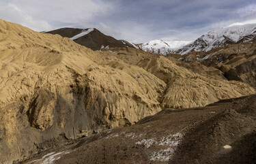 Landscape in Lamayuru, Ladakh - known as the ‘Moonland’, due to its unique terrain that resembles the surface of the moon. Barren mountains, rocky outcrops, create a stark and otherworldly atmosphere.
