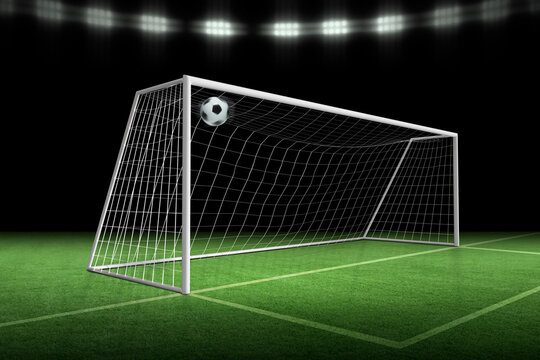 soccer ball in goal, spotlight background in stadium
