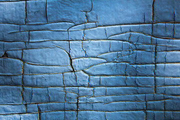 Old wooden board with blue cracked paint. Texture, background.