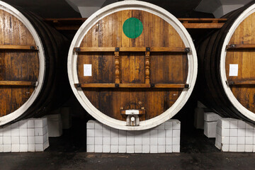 Barrels  in a winery basement, front view
