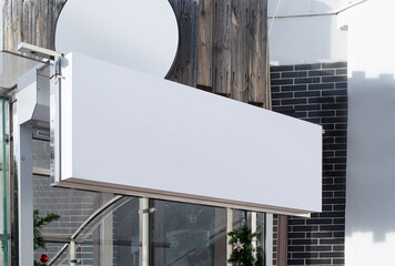real establishment exterior with white walls , white logos for mockup design
