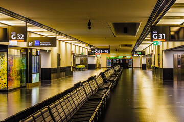 illuminated hall with many seats in the morning at the airport