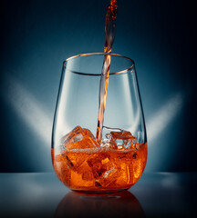 Fresh Orange Energie Drink in Gin Glas with Ice cubes - obrazy, fototapety, plakaty