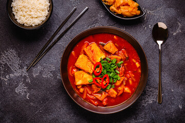Korean traditional food, spicy kimchi soup (kimchi tige) with pork and tofu cheese.