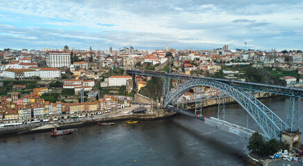 Fototapeta na wymiar Porto, Portugal - 12.25.2022: Aerial view of the old city and the Don Luis bridge in Porto. High quality photo