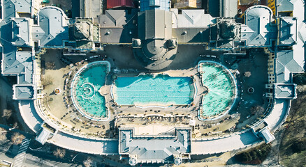 Aerial drone view of the famous Szechenyi Thermal Bath and Spa on a sunny autumn day in Budapest, Hungary. High quality photo