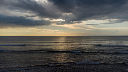 Dramatic Ocean Sunset with Golden Light Reflection