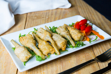 Dish with battered artichokes. Traditional Spanish tapa.