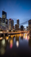 city skyline in the evening with reflection in water