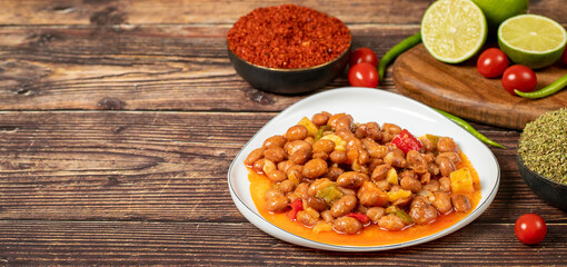 Red kidney beans dish with olive oil on wood floor. Healthy foods. Aegean cuisine delicacies. Empty space for text. Copy space
