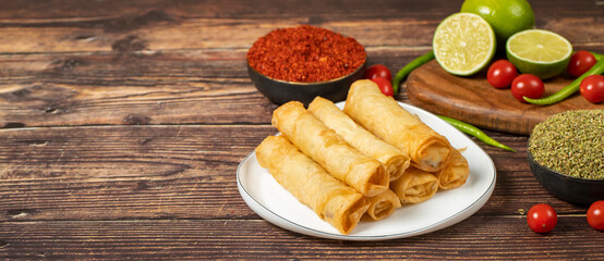 Cigarette pastry. Cheese pie on wood floor. Fried cheese rolls with phyllo. Local name sigara...