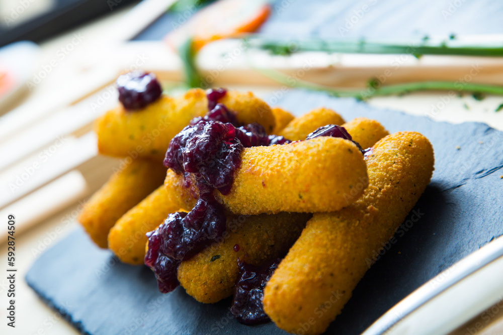 Wall mural fried mozzarella sticks with jam.