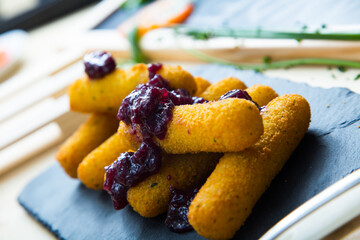 Fried mozzarella sticks with jam.