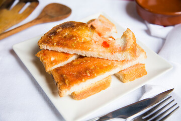 Toasted bread with tomato and oil. Traditional Spanish tapa.
